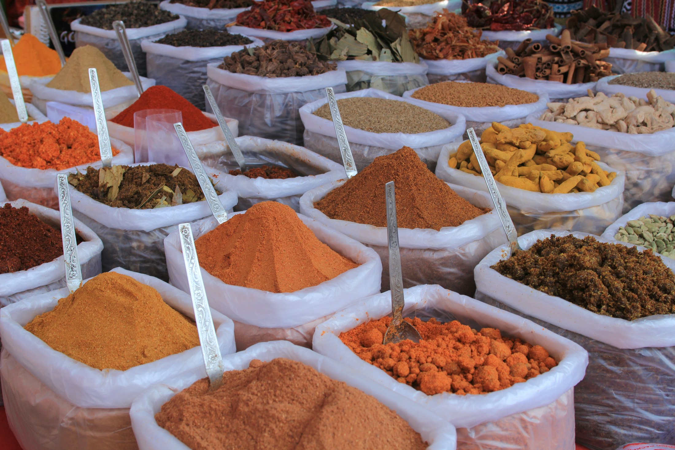 Open sacks of dried herbs and spices